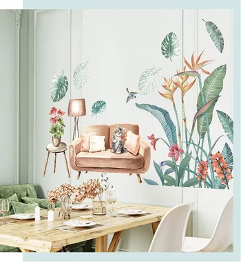 Tranh dán tường chú mèo ngồi trên ghế sofa và những chiếc lá xanh